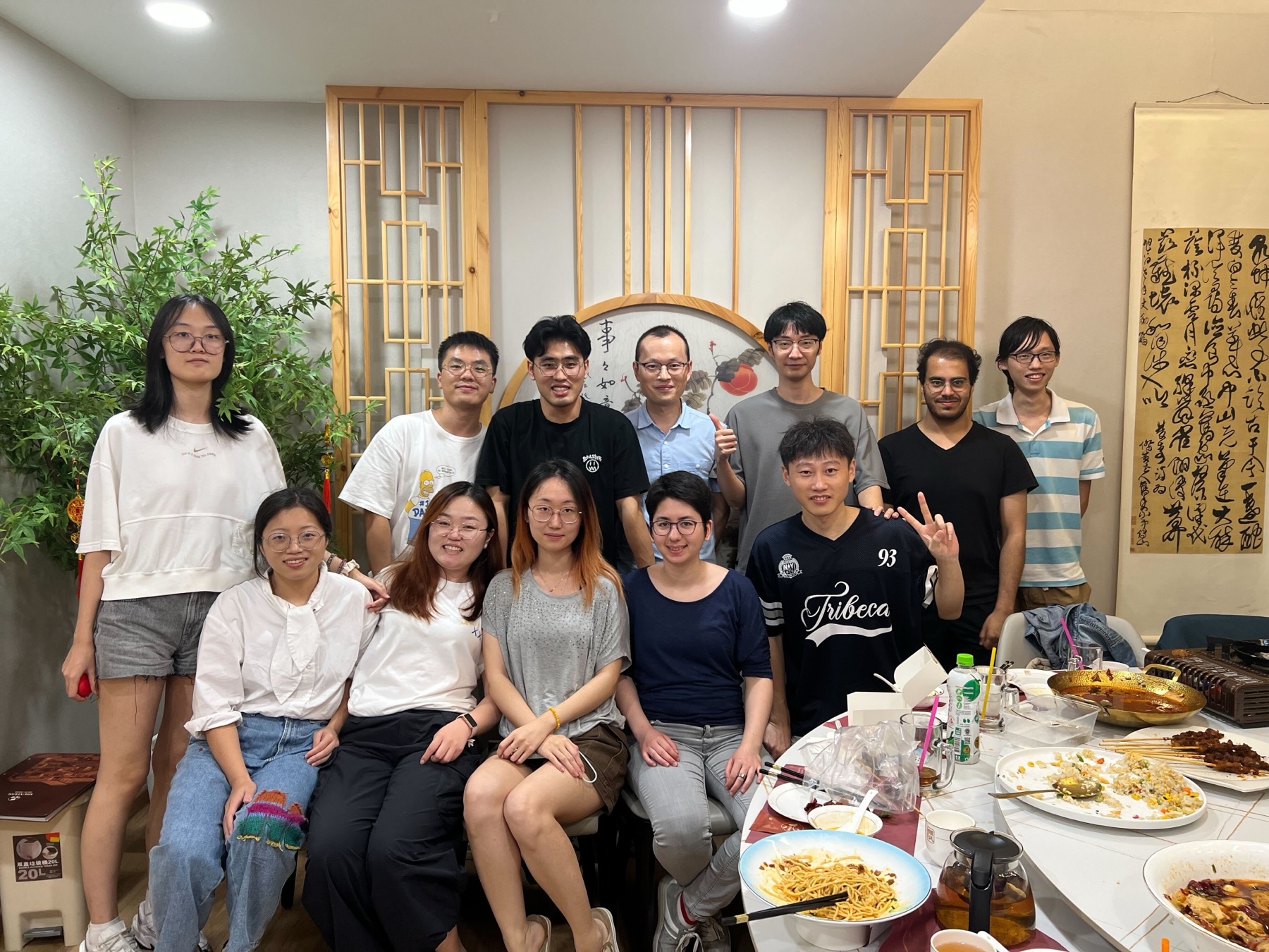 Jiao Lab members gathered around the table for a team dinner
